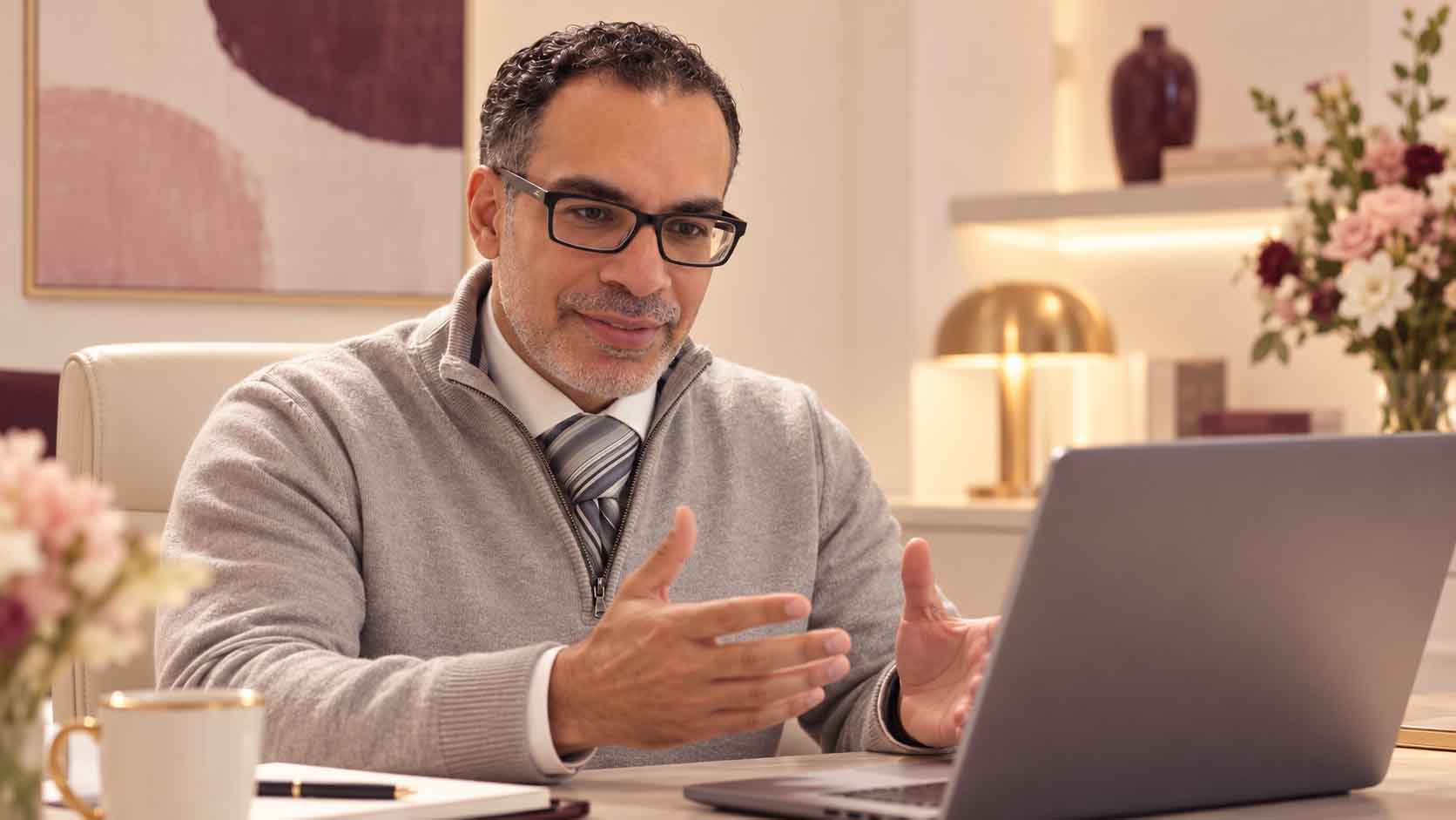 Dr Elsheikh speaking with a patient by video call
